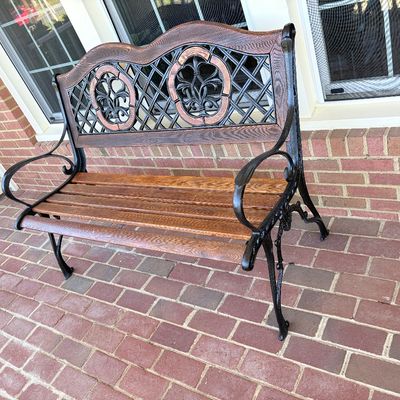 Sale Photo Thumbnail #163: Cast iron and slatted wood garden bench featuring a decorative lattice and fleur-de-lis backrest.