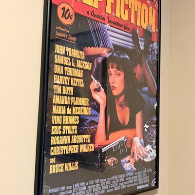 Sale Photo Thumbnail #220: Framed Pulp Fiction movie poster featuring Uma Thurman, presented in a slim black frame.