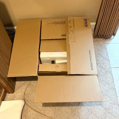 Sale Photo Thumbnail #222: Open box for an Epson Home Cinema 5050UB projector, complete with original foam inserts and interior cardboard packaging.