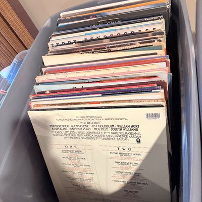 Sale Photo Thumbnail #176: Plastic storage bin packed with vintage vinyl LP record albums, featuring soundtrack and pop titles such as "The Big Chill."