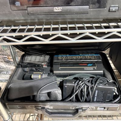 Sale Photo Thumbnail #206: Vintage Panasonic OmniMovie HQ AF Digital camcorder with accessories, fitted inside a original hard shell carrying case.