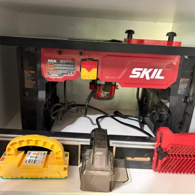 Sale Photo Thumbnail #43: Skil benchtop router table combo with attached router, fence, push block, and featherboard accessories.