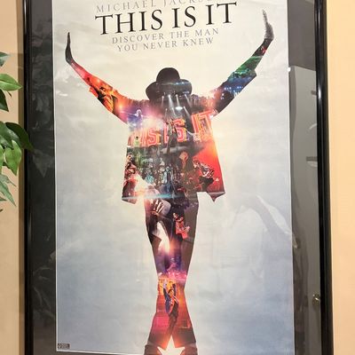 Sale Photo Thumbnail #215: Framed promotional poster for Michael Jackson's "This Is It" documentary, featuring his iconic silhouette filled with performance imagery.