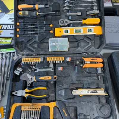 Sale Photo Thumbnail #40: Deko general household hand tool kit in a molded black hard plastic case, featuring yellow and black grips.