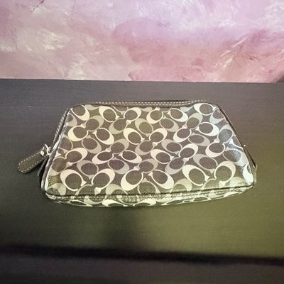 Sale Photo Thumbnail #299: Coach black and grey signature C monogram canvas cosmetic pouch with zip closure and leather pull tab.