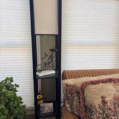 Sale Photo Thumbnail #148: Modern black wooden shelf floor lamp featuring built-in display tiers and a fabric shade.