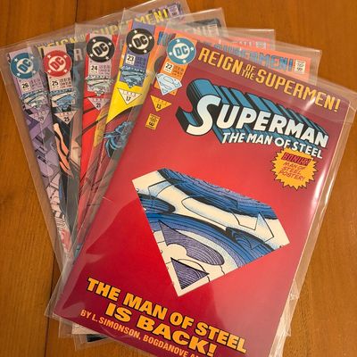 Fanned stack of 1993 DC Comics Superman: The Man of Steel 'Reign of the Supermen!' issues in protective sleeves.