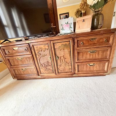 Sale Photo Thumbnail #281: Vintage Asian-style wooden credenza dresser featuring carved landscape doors, brass hardware accent trim, and side drawers.