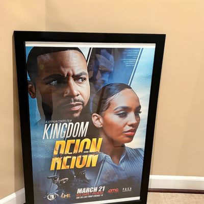 Sale Photo Thumbnail #216: Framed movie poster for the film Kingdom Reign, featuring cast members and premiere details in a sleek black frame.