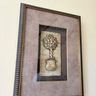 Sale Photo Thumbnail #141: Framed 3D wall art featuring a relief sculpture of a topiaried fruit tree in a decorative pot, housed in a ribbed dark wood frame with double matting.