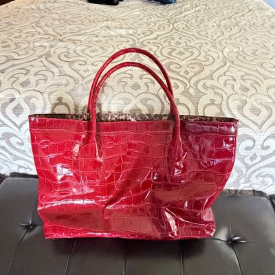 Sale Photo Thumbnail #301: Red patent faux-croc tote bag with shoulder straps and leopard print lining.