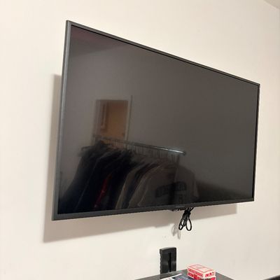 Sale Photo Thumbnail #231: Wall-mounted Insignia flat-screen television with black bezel, appearing in good clean condition.