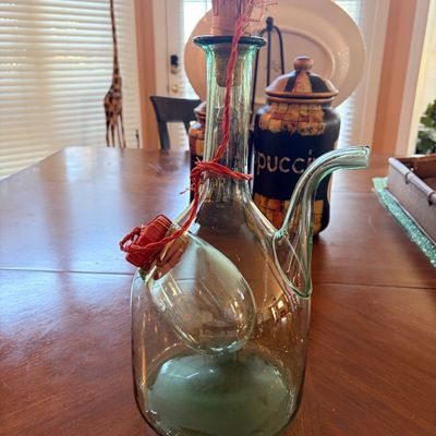 Sale Photo Thumbnail #145: Vintage glass wine or oil decanter featuring an internal ice chamber, side spout, and straw-wrapped stopper.