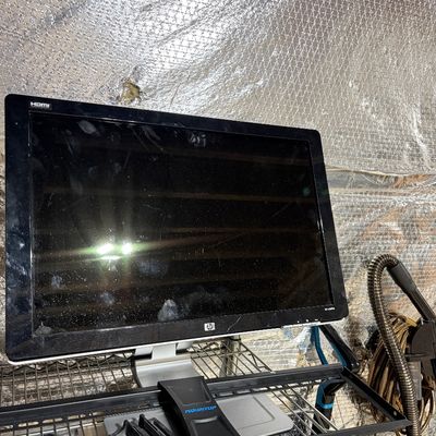 Sale Photo Thumbnail #209: HP flat screen computer monitor with HDMI support, sitting on a wire rack next to a MOUNTUP bracket.