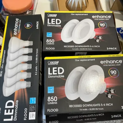 Sale Photo Thumbnail #18: Selection of Feit Electric Enhance LED flood lights and recessed downlights in original boxes, alongside hardware and automotive polishing pads.