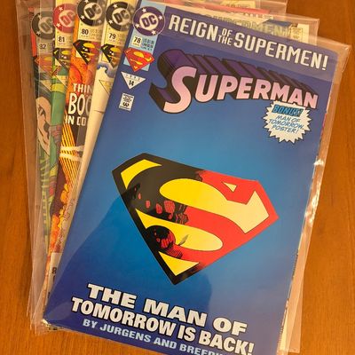 Stack of bagged and boarded DC Superman comic books from the 1993 'Reign of the Supermen!' storyline, featuring Superman #78 on...