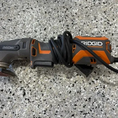 Sale Photo Thumbnail #60: Ridgid JobMax corded multi-tool with attached sanding pad accessory.