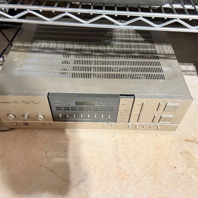 Sale Photo Thumbnail #205: Vintage Pioneer stereo receiver with champagne gold faceplate and digital display, circa 1980s.
