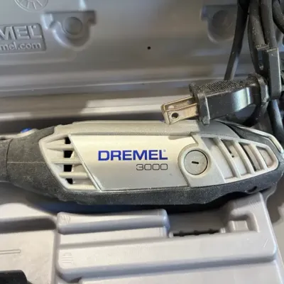 Sale Photo Thumbnail #31: Dremel 3000 variable speed rotary tool set housed in its original plastic carrying case.