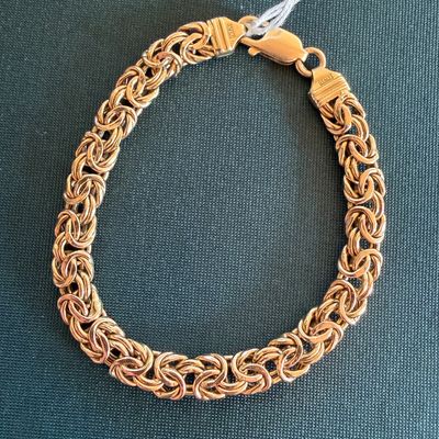 Gold Byzantine chain link bracelet stamped "ITALY" near the lobster claw clasp. 14k gold.