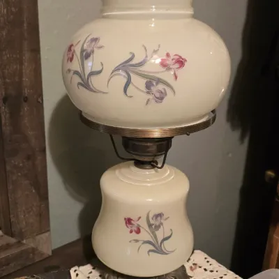 Sale Photo Thumbnail #9: Vintage Gone with the Wind style electric table lamp with a hand-painted floral pattern, ruffled milk glass globe shade, and clear glass chimney.