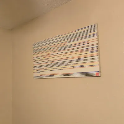 Sale Photo Thumbnail #16: Horizontal abstract wall art canvas featuring colorful geometric lines in blue, yellow, red, and black on a white background.