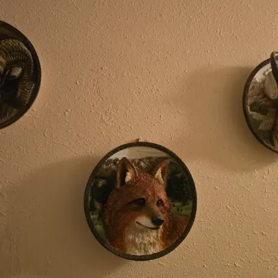 Sale Photo Thumbnail #25: Set of three vintage 3D wall plaques depicting a bighorn sheep, a fox, and an antelope in naturalistic settings.