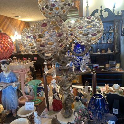 Sale Photo Thumbnail #95: Vintage Hollywood Regency cherub table lamp featuring multiple textured glass globes with colorful cabochon accents and crystal prisms, set on a brass and marble base.