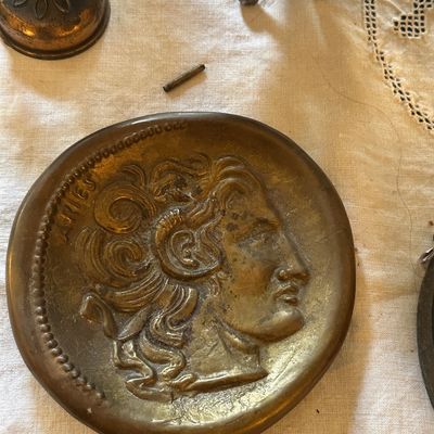 Sale Photo Thumbnail #42: Vintage brass or bronze zodiac tray featuring an embossed Aries profile design.