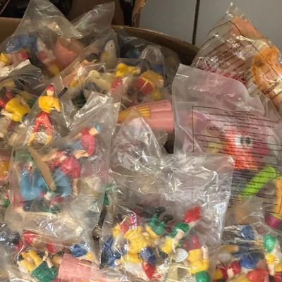Sale Photo Thumbnail #47: Large collection of vintage plastic fast-food toy figures individually sealed in original clear plastic bags.