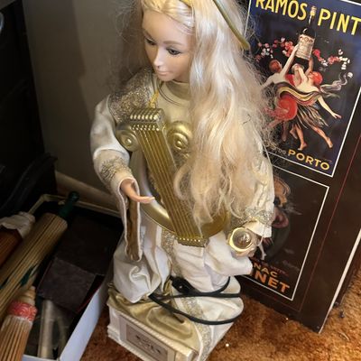 Sale Photo Thumbnail #40: Vintage animated blonde angel Christmas figure holding a harp and wearing a gold-trimmed white gown.