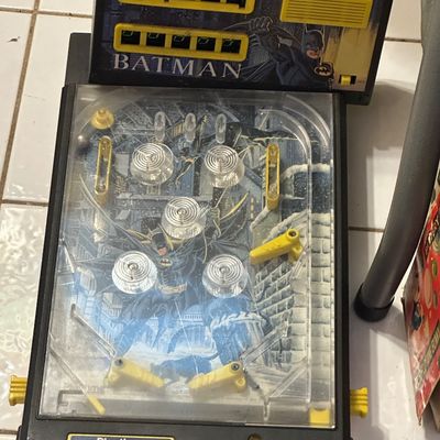 Sale Photo Thumbnail #45: Vintage Playtime Batman electronic tabletop pinball game, featuring manual scoring and original character graphics.