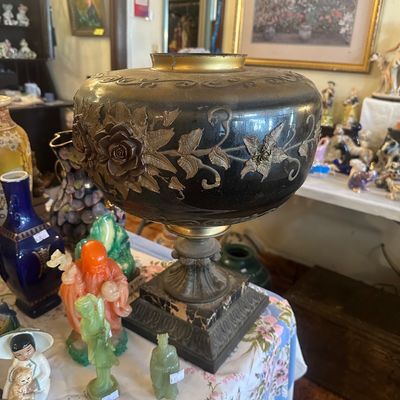 Sale Photo Thumbnail #91: Antique Gilded Age brass oil lamp base converted for electric use, featuring relief floral rose motifs on an ornate cast metal and marble footed pedestal.
