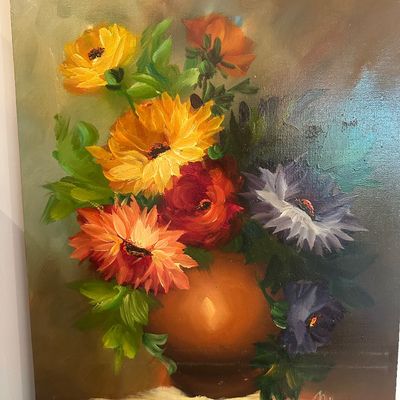 Sale Photo Thumbnail #116: Framed vintage floral still life oil painting on canvas depicting a vibrant bouquet in a terracotta vase, signed in the lower right corner.