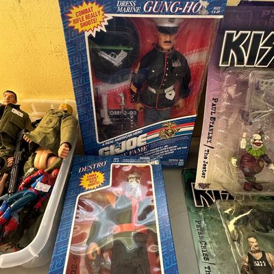 Sale Photo Thumbnail #50: Selection of vintage packaged 1990s G.I. Joe Hall of Fame action figures, including Dress Marine Gung-Ho and Destro, alongside KISS collector figures.
