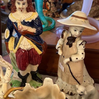 Sale Photo Thumbnail #37: Pair of vintage hand-painted ceramic figurines depicting a cavalier man and a shepherdess woman with a lamb.