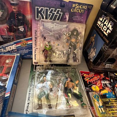 Sale Photo Thumbnail #51: Collection of vintage action figures in original blister packaging, including McFarlane Toys KISS Psycho Circus figures, a G.I. Joe Gung-Ho Hall of Fame figure, and a Street Fighter II Chun-Li figure.