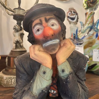 Sale Photo Thumbnail #117: Vintage painted hobo clown bust with hands propped on chin, depicting a forlorn expression in classic mid-century style.