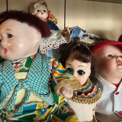 Sale Photo Thumbnail #30: Collection of vintage porcelain and composition dolls, including a doll in traditional Japanese clothing.
