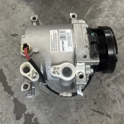 Sale Photo Thumbnail #74: Automotive A/C compressor unit with attached clutch pulley, part number DW77483.