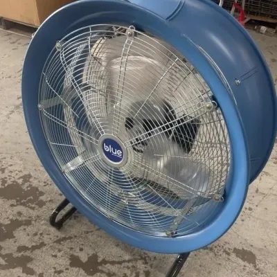 Sale Photo Thumbnail #41: Blue brand commercial high-velocity industrial drum fan with a blue housing and metal safety cage.