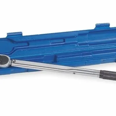 Sale Photo Thumbnail #76: Adjustable drive torque wrench with a black knurled handle, resting on its open blue plastic storage case.