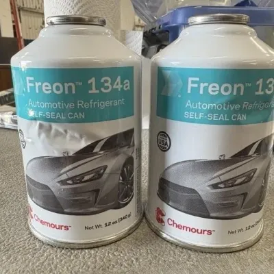 Sale Photo Thumbnail #54: Two 12-ounce cans of Chemours Freon 134a self-seal automotive refrigerant.