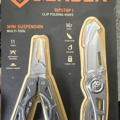 Sale Photo Thumbnail #132: Gerber two-piece tool set in original unopened blister packaging, including a Mini Suspension multi-tool and a Ripstop I clip folding knife.