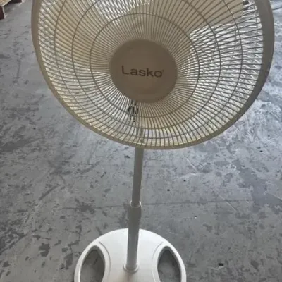 Sale Photo Thumbnail #66: Lasko white plastic oscillating pedestal fan on an adjustable metal pole.
