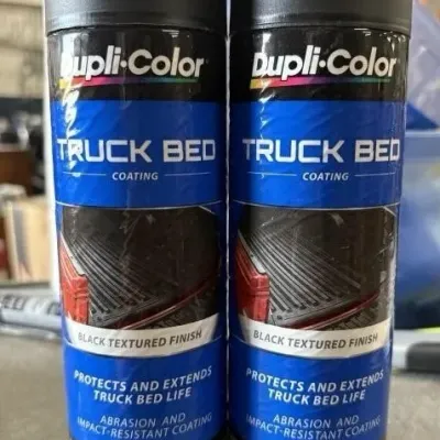 Sale Photo Thumbnail #52: Two 16.5 oz aerosol cans of Dupli-Color truck bed coating in black textured finish.
