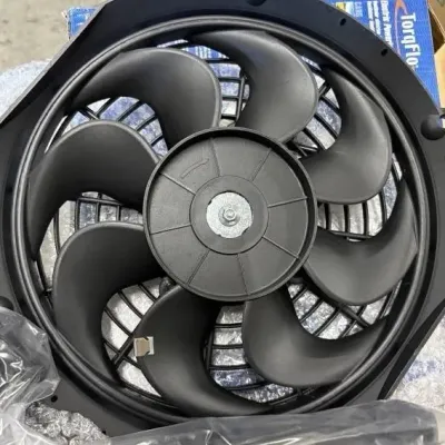 Sale Photo Thumbnail #170: TorqFlo electric radiator cooling fan with curved plastic blades, shown in like-new condition in its original packaging.