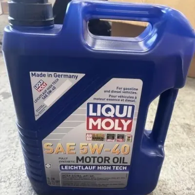Sale Photo Thumbnail #3: 5-liter jug of Liqui Moly Leichtlauf High Tech SAE 5W-40 fully synthetic motor oil.
