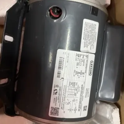Sale Photo Thumbnail #108: Leeson 1 HP electric AC motor with mounting bracket, packaged in original Styrofoam box insert.