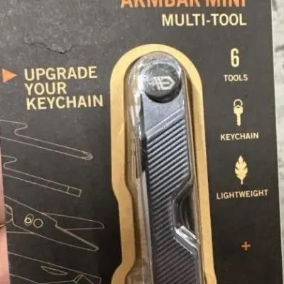 Sale Photo Thumbnail #144: Gerber Armbar Mini multi-tool, new in original blister pack packaging.